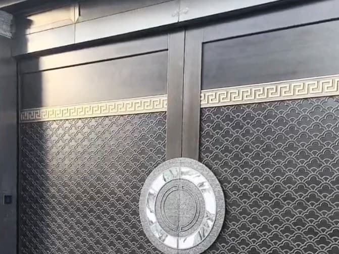 Chinese style double-sided electric copper door in the residential area